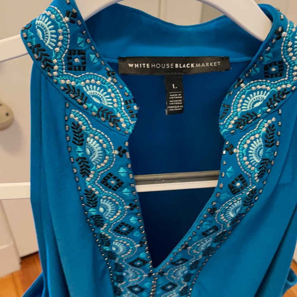 Teal sleeveless dress tag says Large, fits like a Medium. Great dress to travel
